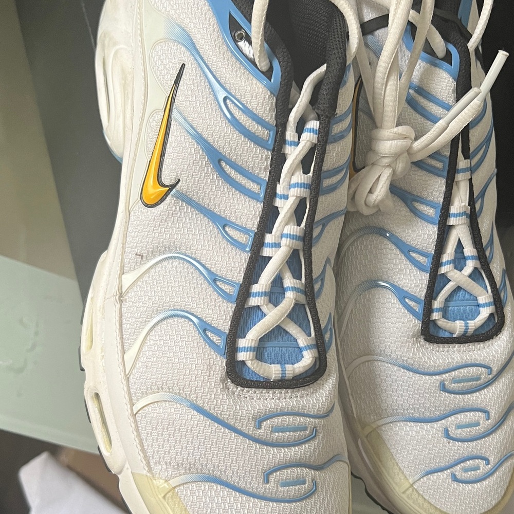 White and Blue Sneakers with Yellow Swoosh